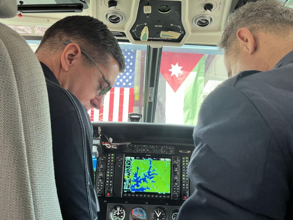 IOMAX's Alan Wilkes shows off the cockpit of a Textron Cessna Caravan